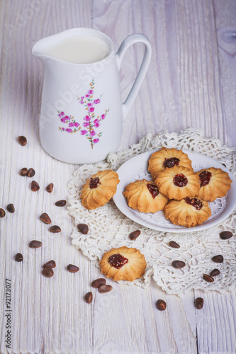Jug with milk and cookie
