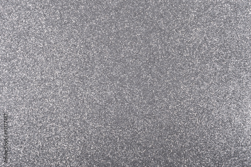 Silver background with metallic glitter texture in full frame