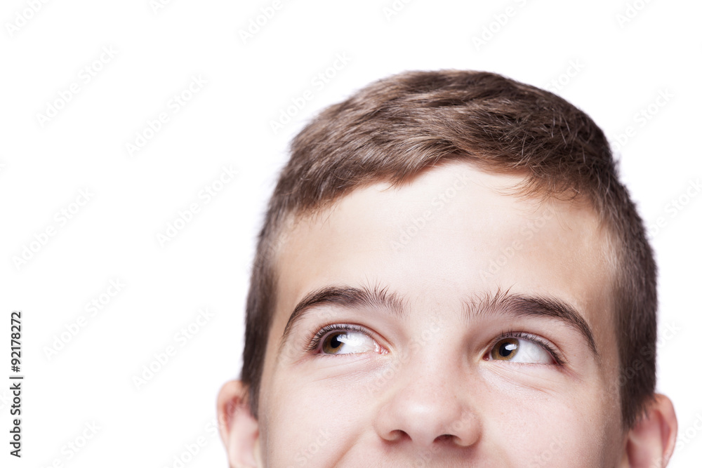 Teen boy looking up, isolated on white background Teen boy looking up, isolated on white background