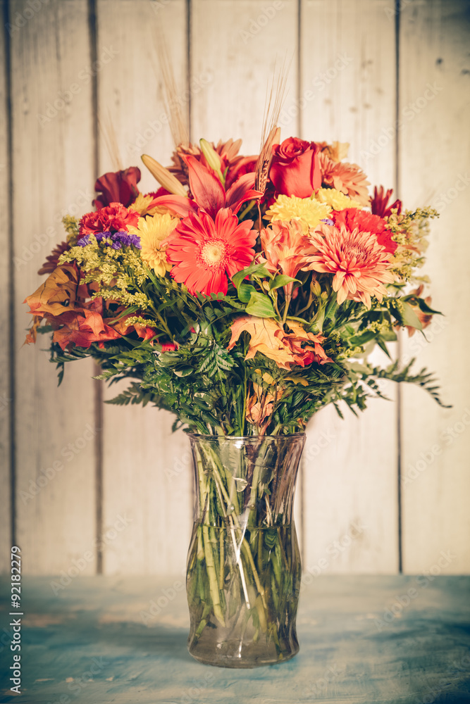 Autumn flower bouquet in vase with vintage tone filter effect - obrazy, fototapety, plakaty 