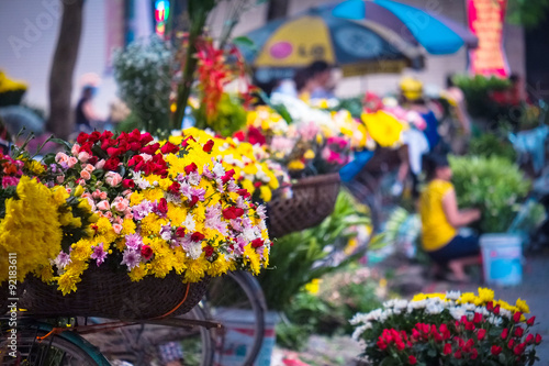 Fototapeta Naklejka Na Ścianę i Meble -  Flower on bicycle in small market, hanoi, vietnam