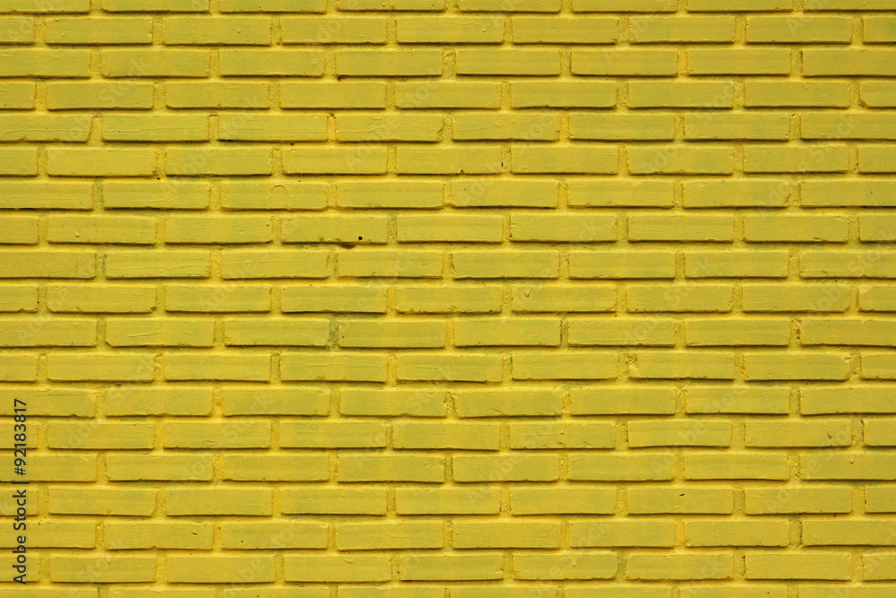 Fototapeta premium Yellow brick wall texture.