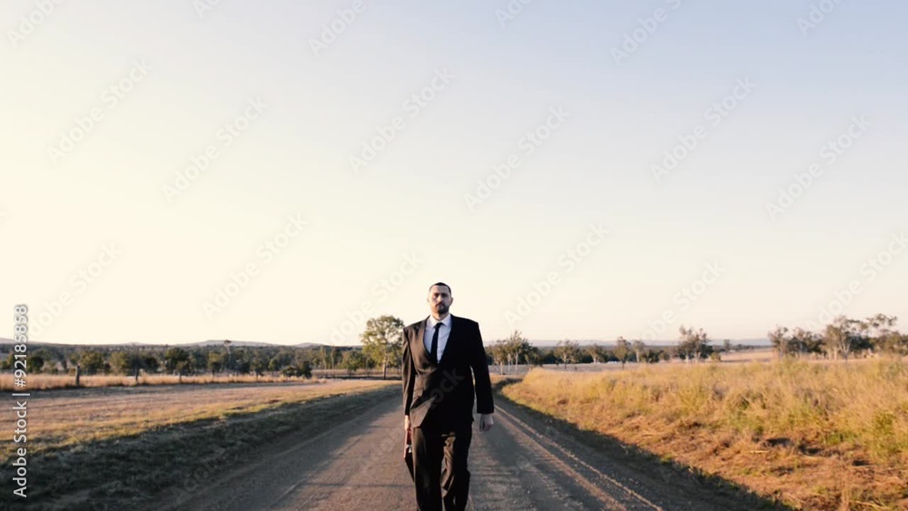 Concept: A frustrated business man is leaving the corporate lifestyle and chasing freedom in the outback of Queensland, Australia. Cinematic Portrait Style. Concept: A frustrated business man is leaving the corporate lifestyle and chasing freedom in the outback of Queensland, Australia. Cinematic Portrait Style.