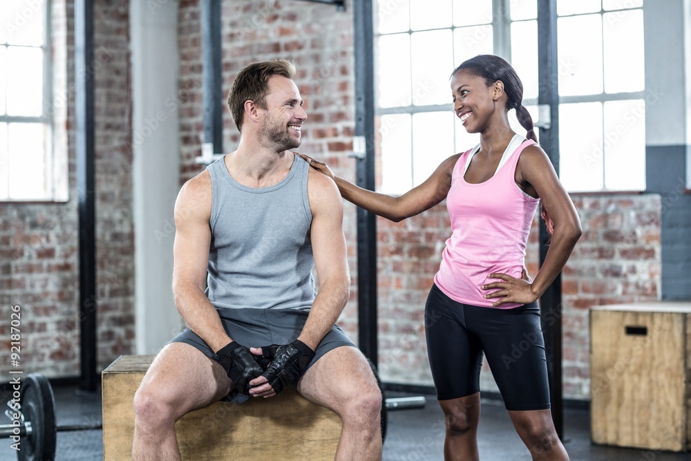 Fit smiling couple look at each other Fit smiling couple look at each other