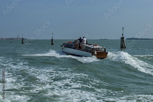 One boat in venetian lagoon, Italy