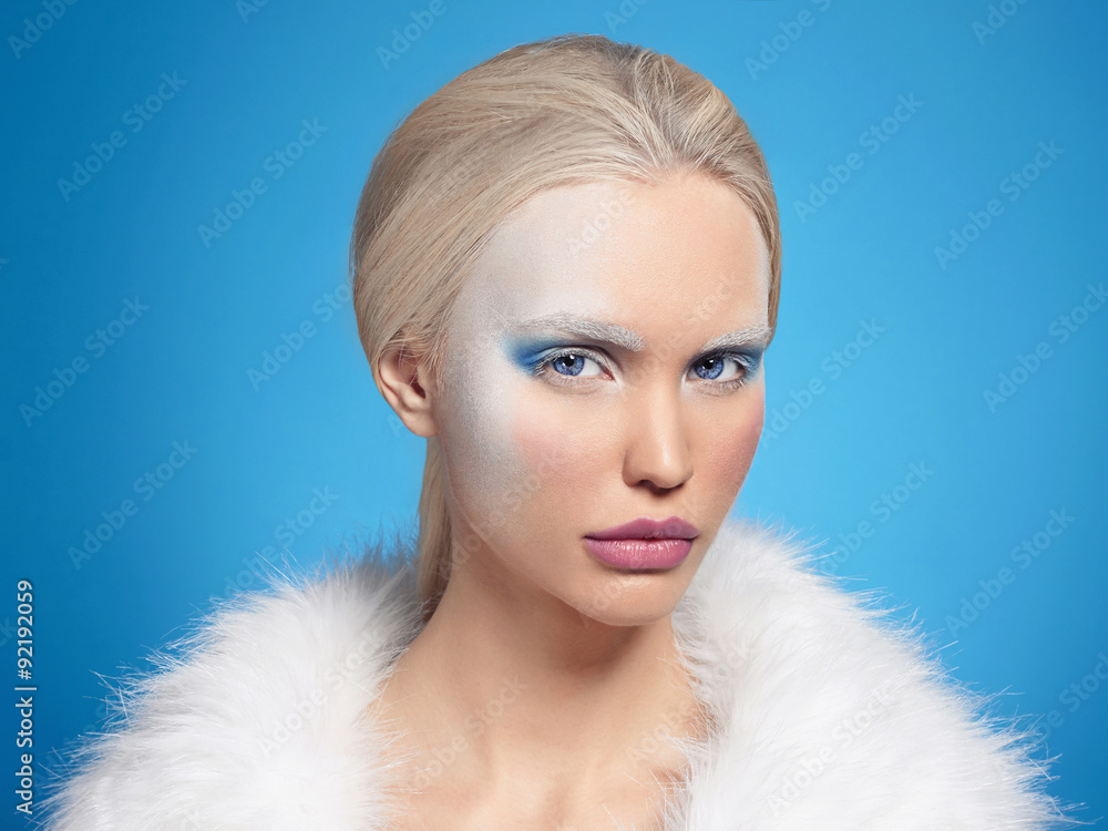 beautiful blond young woman in fur