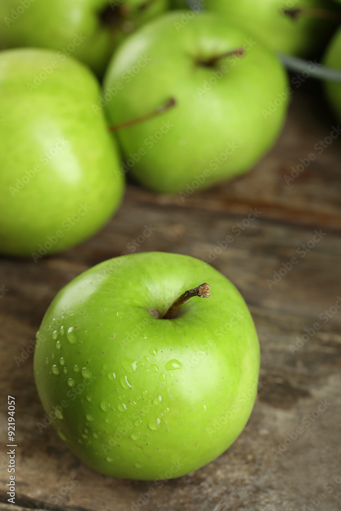 Ripe green apples on wooden table close up Ripe green apples on wooden table close up