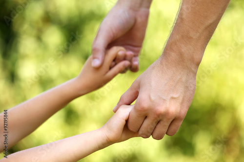 Bilde på lerret Father and daughter hands outdoors