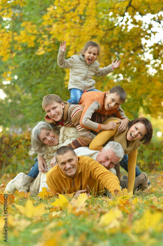 Happy family in autumn forest