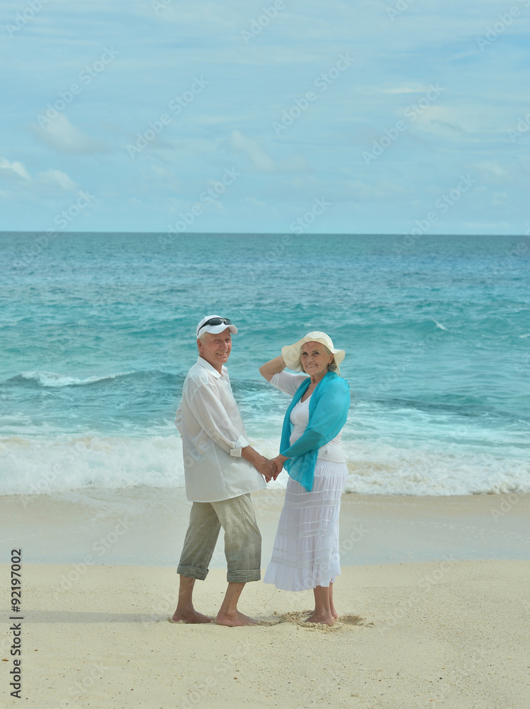 Elderly couple rest at tropical resort Elderly couple rest at tropical resort
