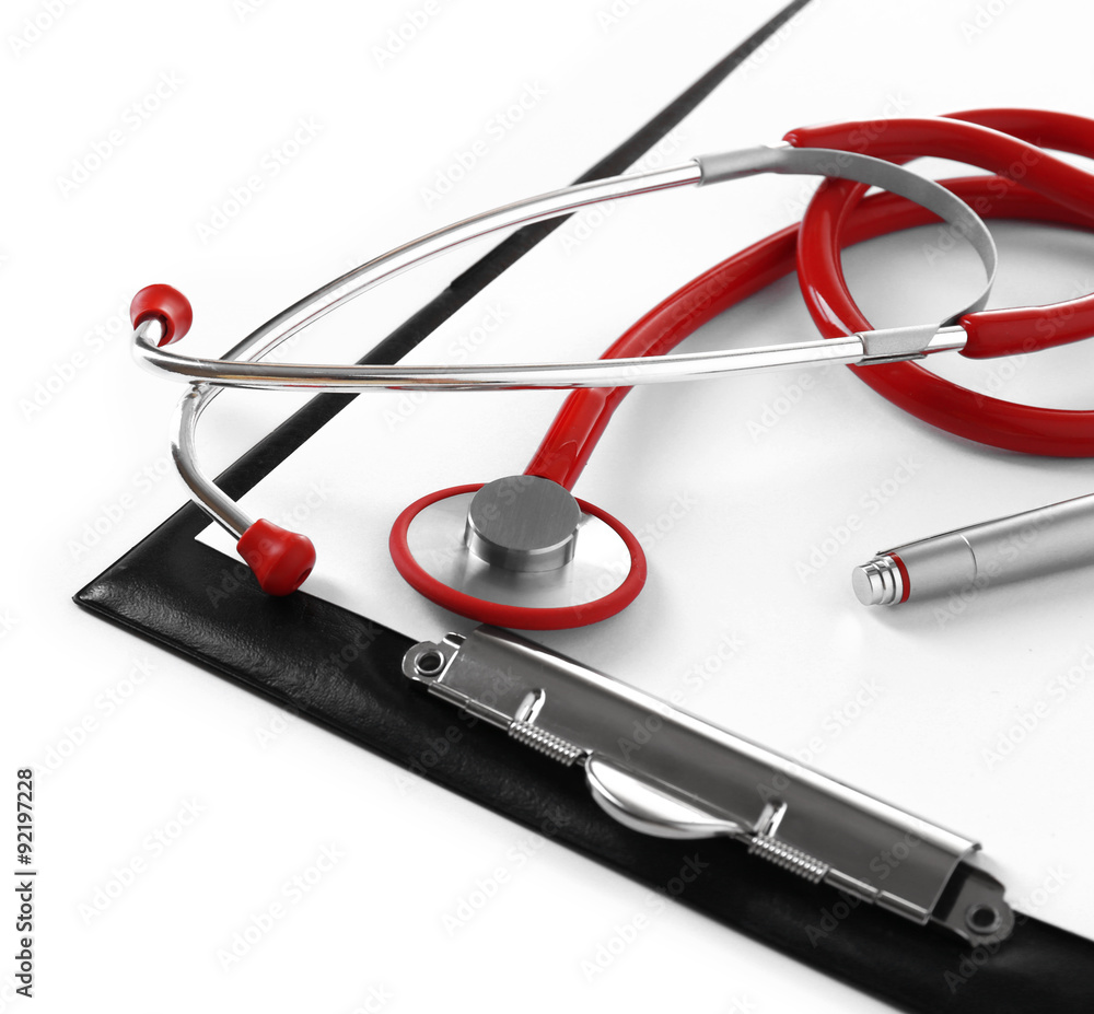 Medical stethoscope with clipboard isolated on white Medical stethoscope with clipboard isolated on white