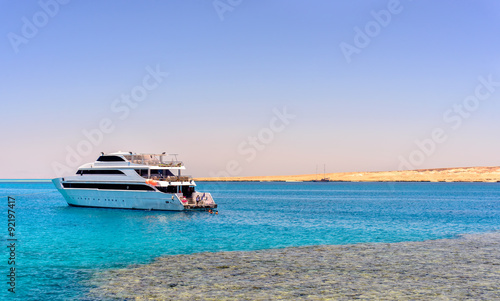 Pleasure boat or tour boat off a reef