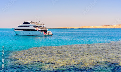 Pleasure boat or tour boat off a reef © Daddy Cool