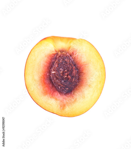 Half of a peach fruit isolated over the white background