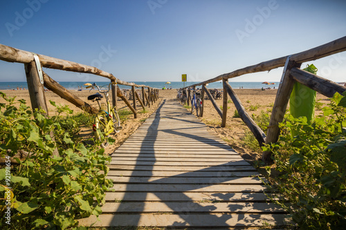 Nice wooden road to beach, sunny day