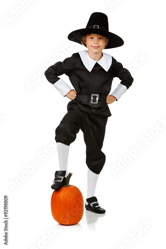 Thanksgiving: Pilgrim With Foot On Pumpkin photo