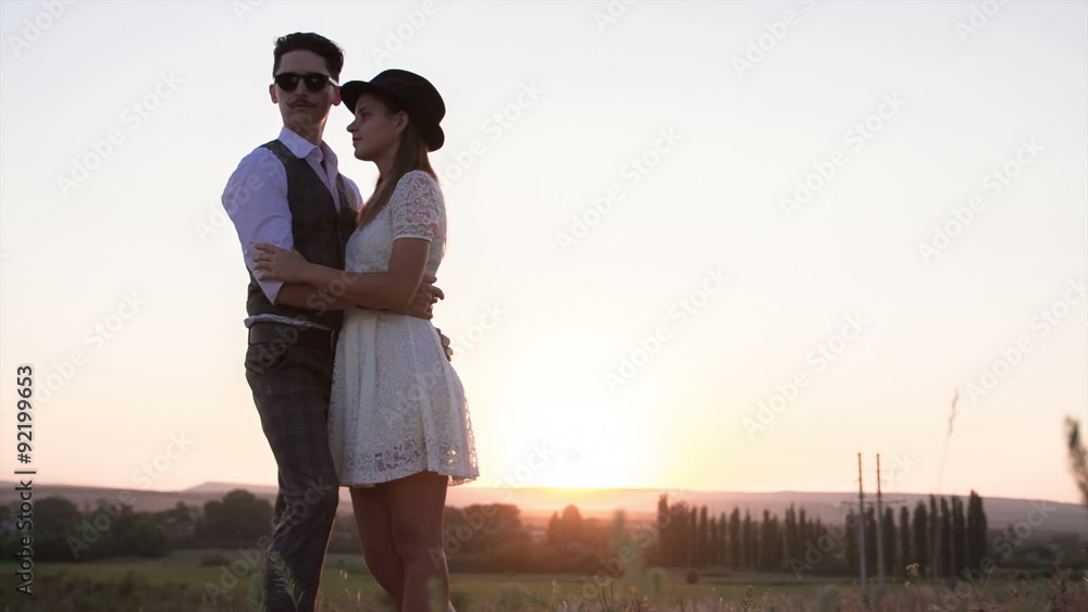 Couple hugging at sunset. Couple hugging at sunset.