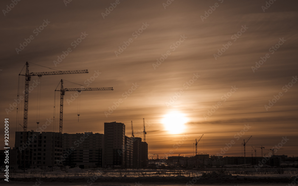 Building of new houses and hoisting tower cranes