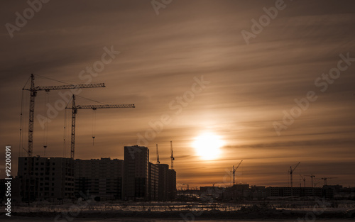 Building of new houses and hoisting tower cranes