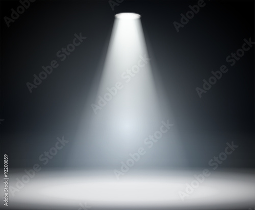 Dark background with spotlight.