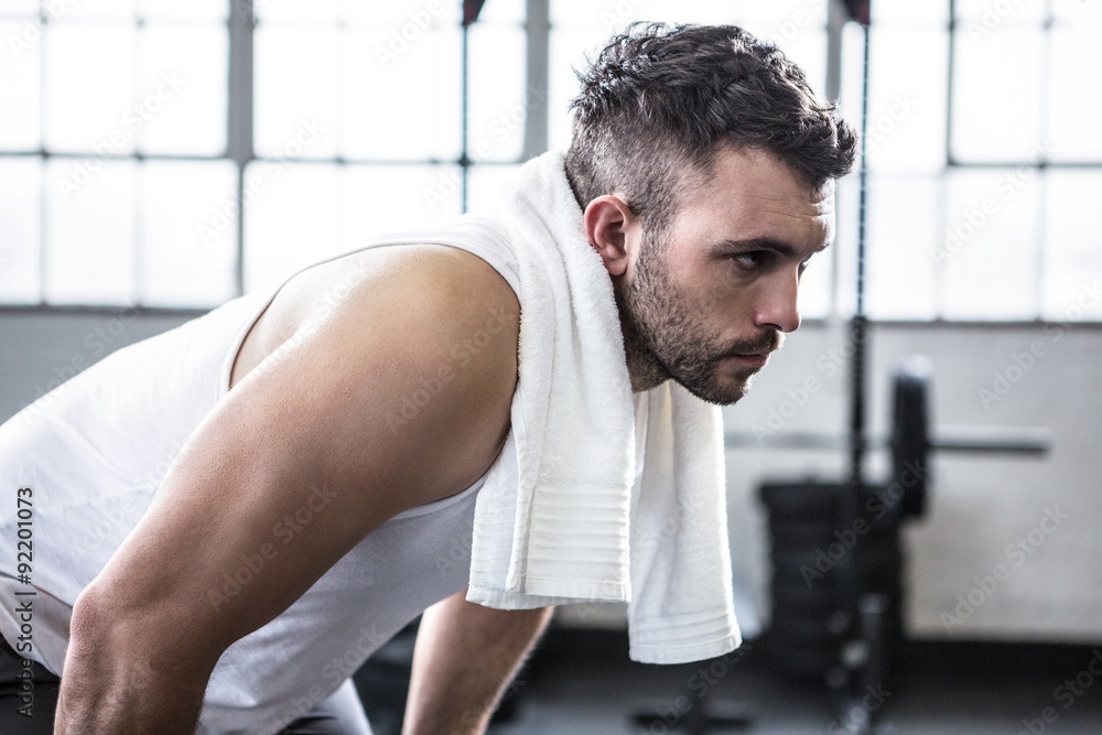 Fit man with towel on shoulders Fit man with towel on shoulders