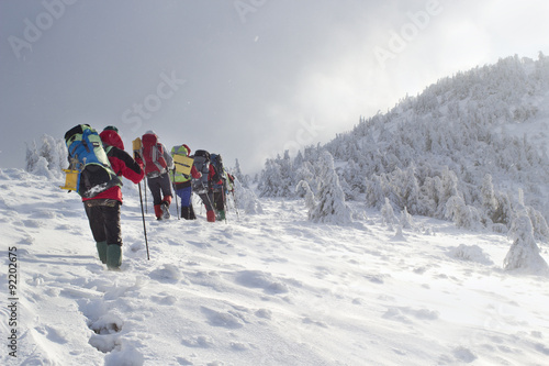 hikers in winter mountains