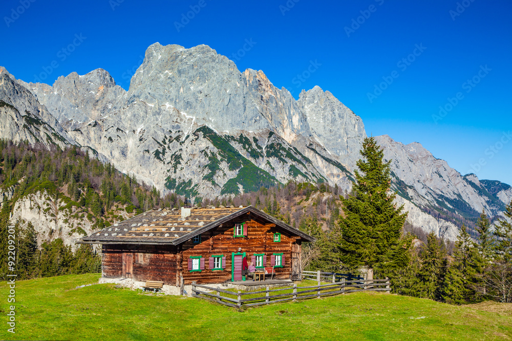 Traditional mountain chalet in the Alps in autumn