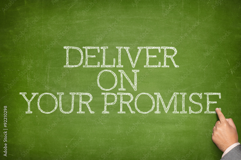 Obraz premium Deliver on your promise text on blackboard