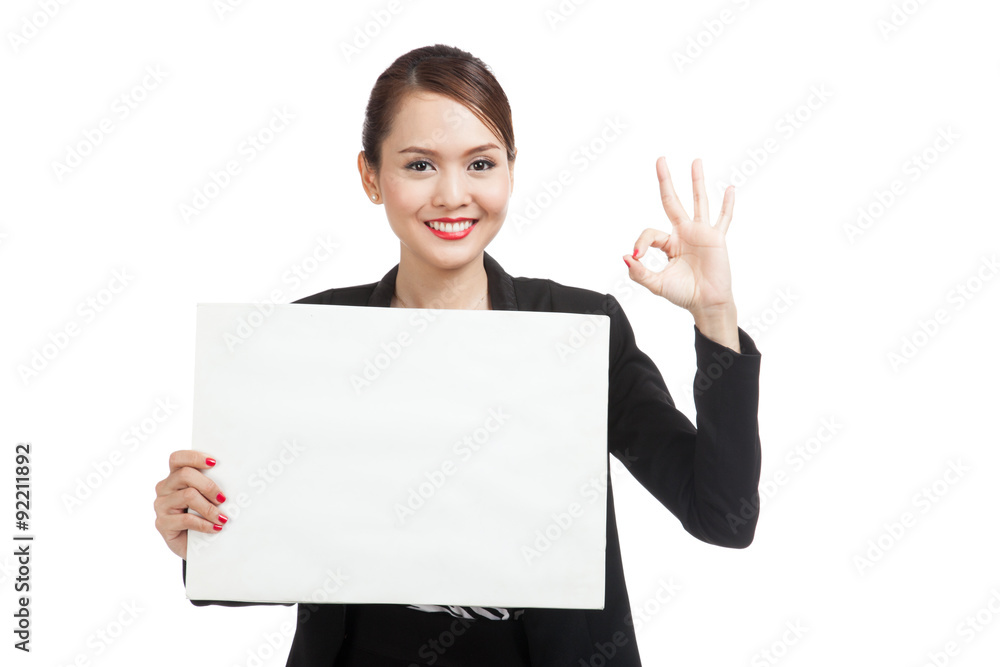 Young Asian business woman show OK with white blank sign Young Asian business woman show OK with white blank sign