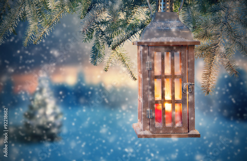 Christmas lantern hanging on fir branches © Jag_cz