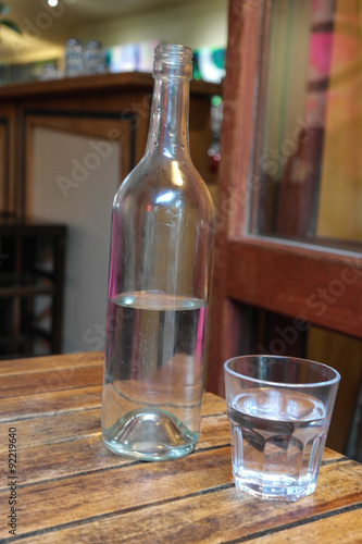Water in bottle and glass photo