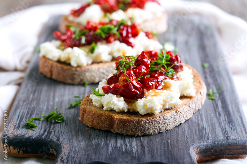 Bread slices with ricotta cheese and, sun dried tomatoes