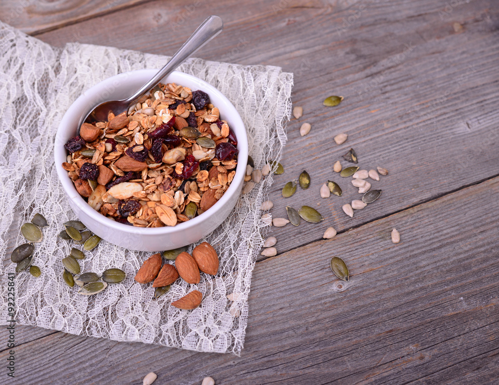 Fototapeta premium Granola from several types of cereals with nuts,coconut chips an