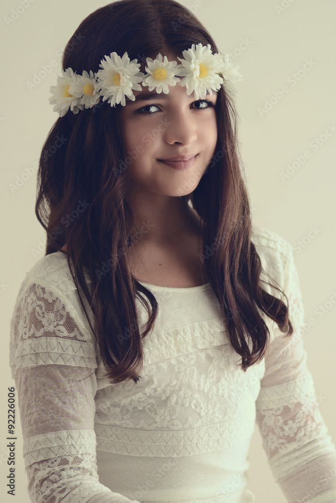 Fototapeta premium Portrait of young girl with flower headband