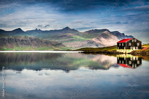 Small house on river bank i...