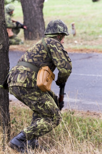 soldier in a camouflage suit fights