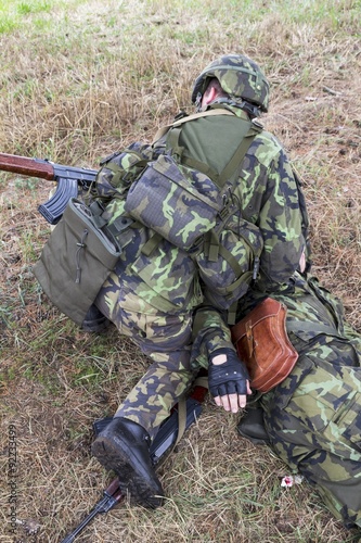 soldier in a camouflage suit fights