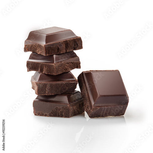 Pieces of black Chocolate isolated on white