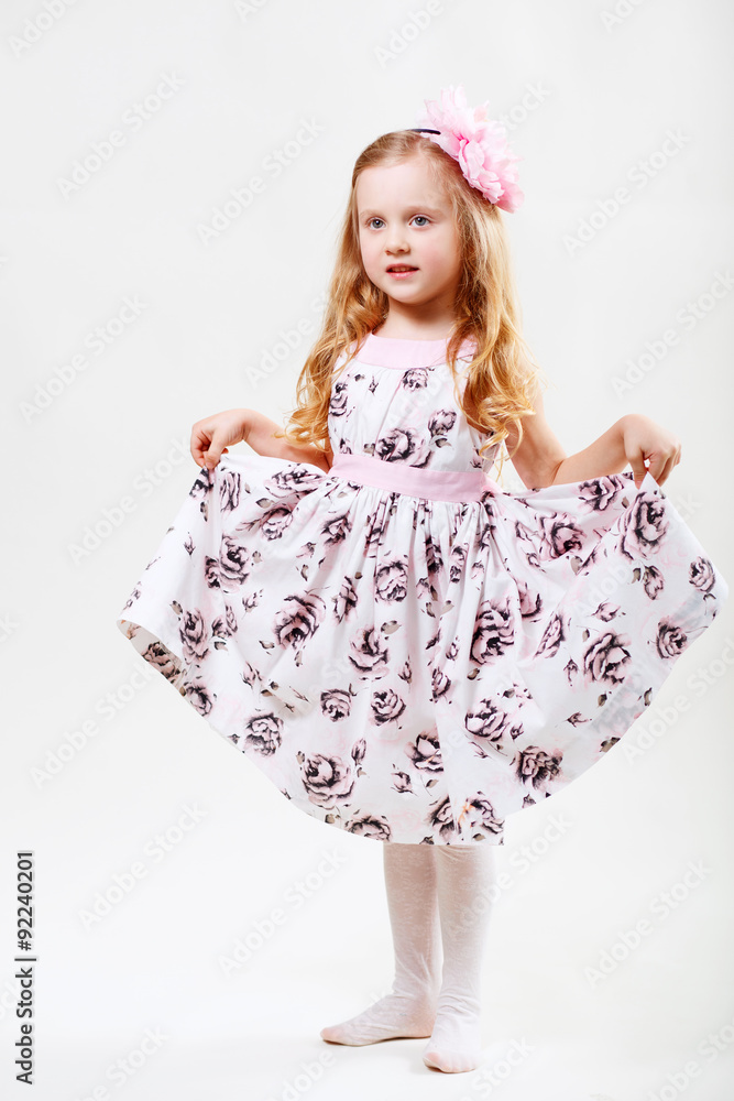 Obraz premium Full length portrait of a cute little dancing girl