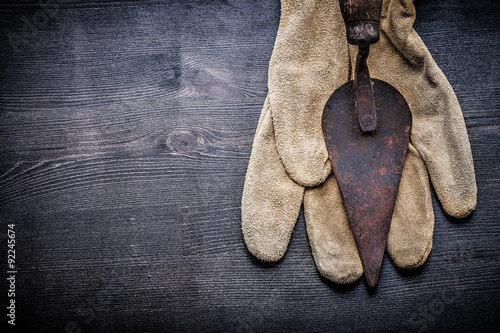 copyspace vintage tools putty spattle on glove photo