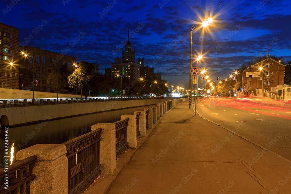embankment Moscow river channel at night.