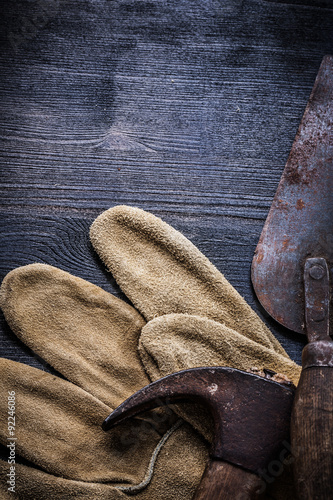 vertical vintage tools claw hammer and putty spattle photo