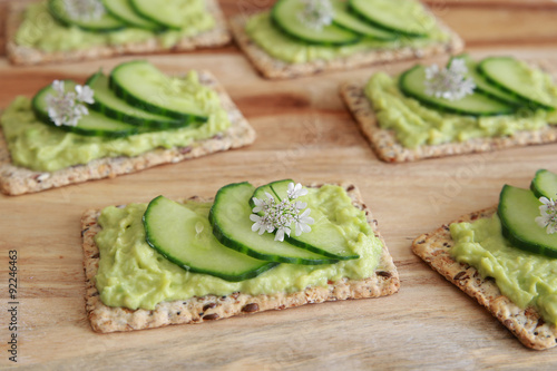 Green cucumber and avocado wholegrain rectangle crackers with co