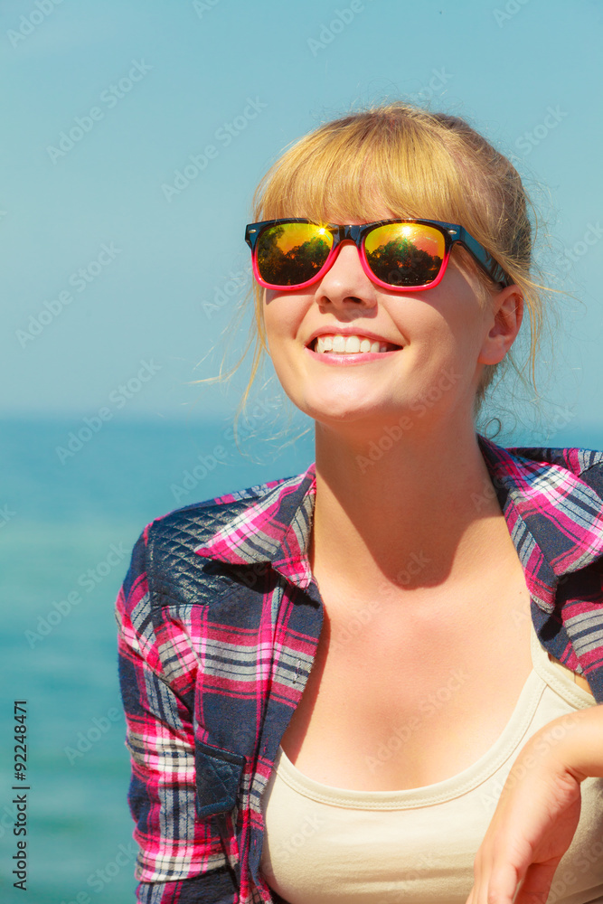 woman hiker relaxing on sea coast woman hiker relaxing on sea coast