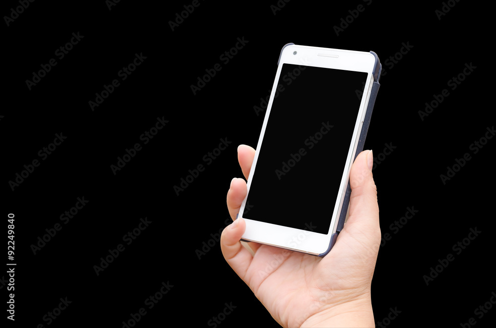 Mobile phone in hand isolated on black background