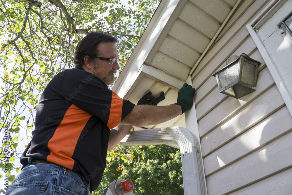 Contractor Popping Vinyl Siding Back In Place Stock Photo Adobe Stock