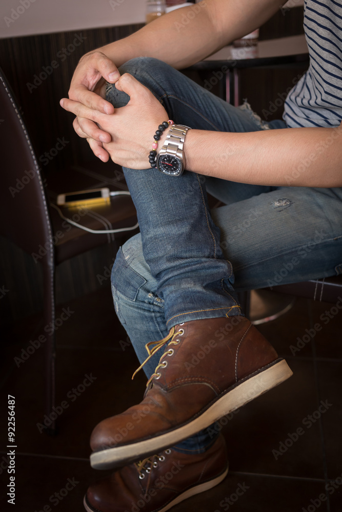 Fototapeta premium brown boot leather shoes and jean pants clothing fashion of man