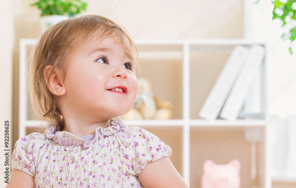 Toddler girl with a giant smile