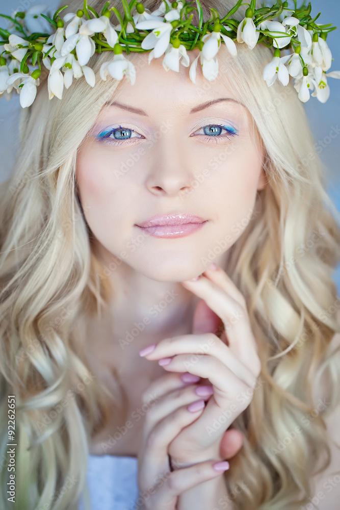 Beautiful woman with snowdrops in her hair Beautiful woman with snowdrops in her hair