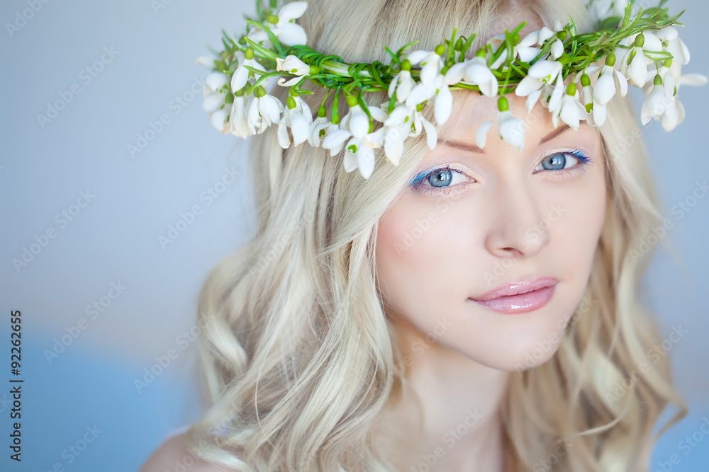 Beautiful woman with snowdrops in her hair Beautiful woman with snowdrops in her hair